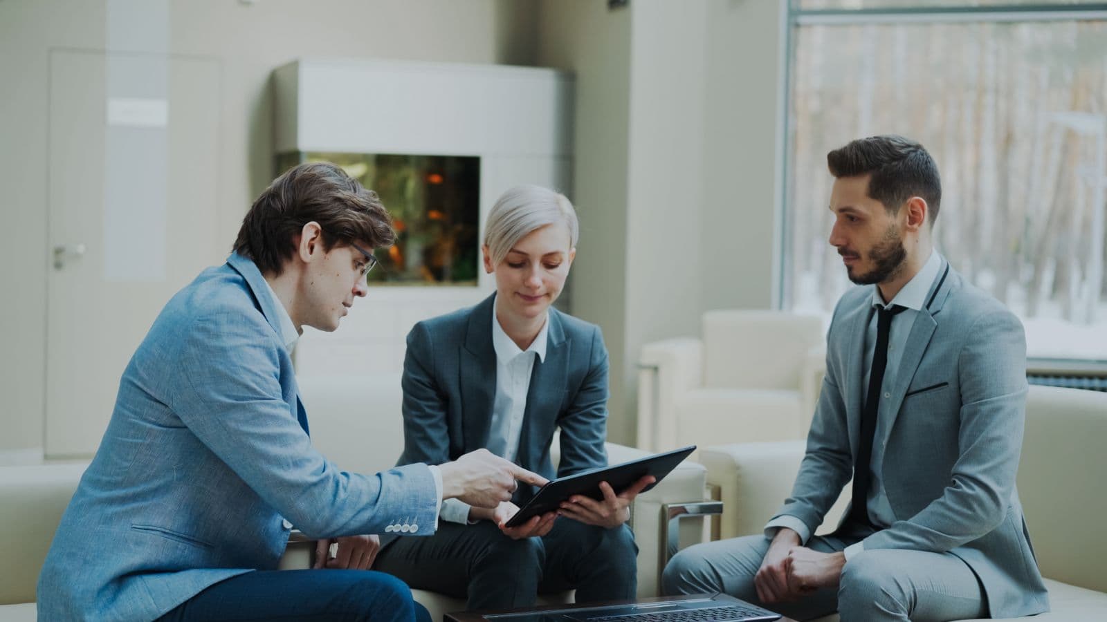 Professional consulting team collaborating in a modern office workspace