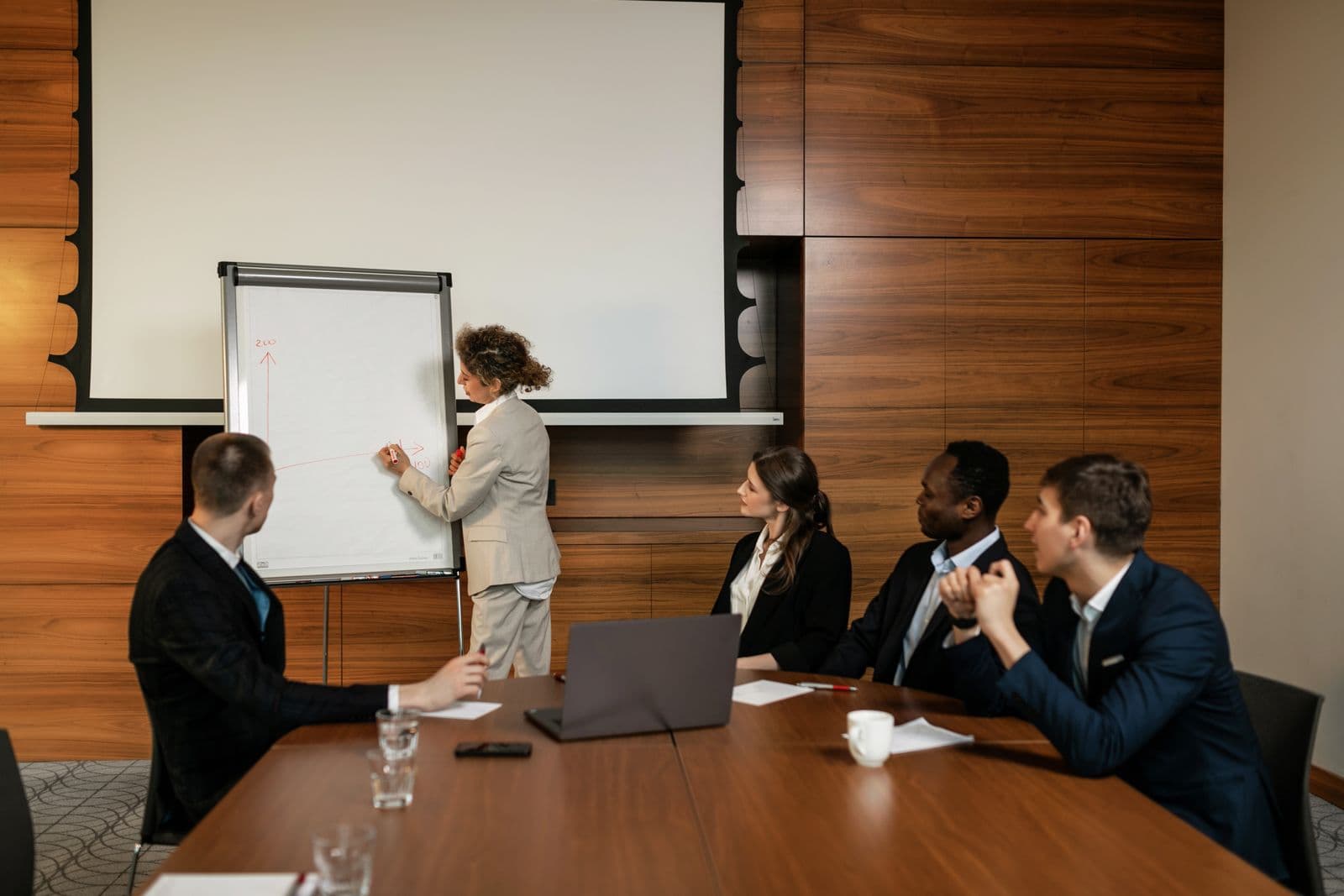 Business team collaborating in a bright modern corporate boardroom