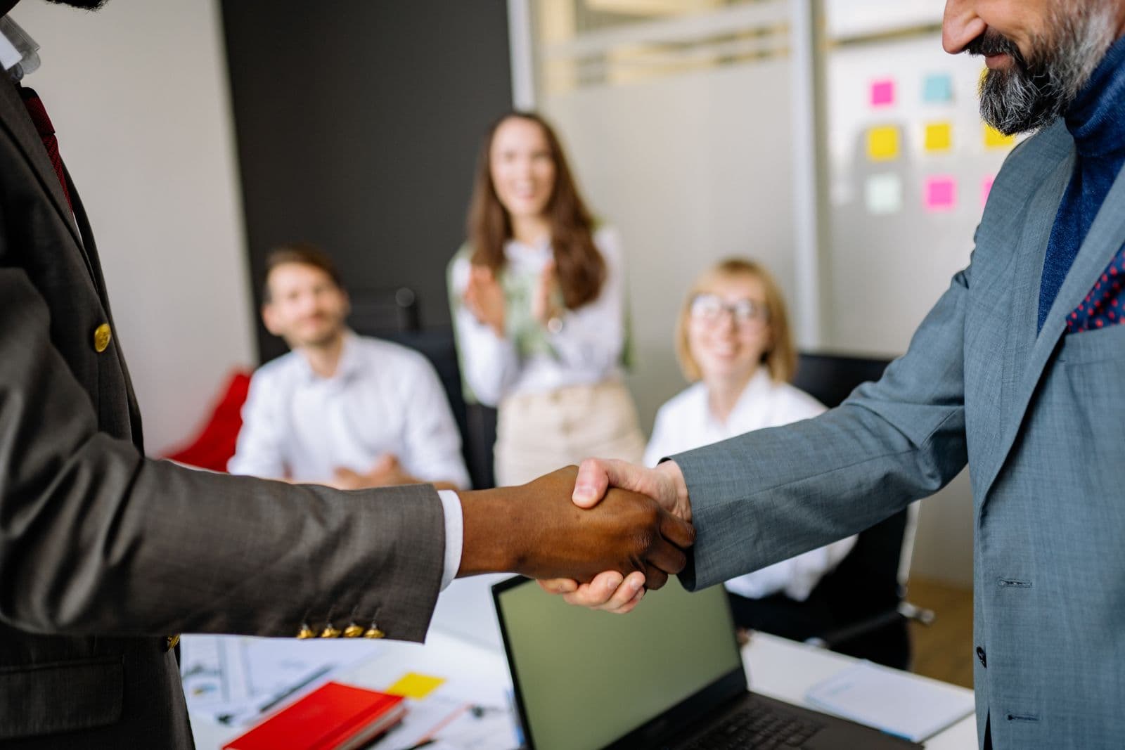Lawyer and client sealing a consultation with a friendly handshake